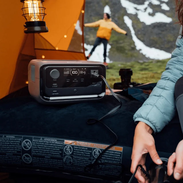 EcoFlow River 3 Max portable power station in a camping setting powering devices inside a tent
