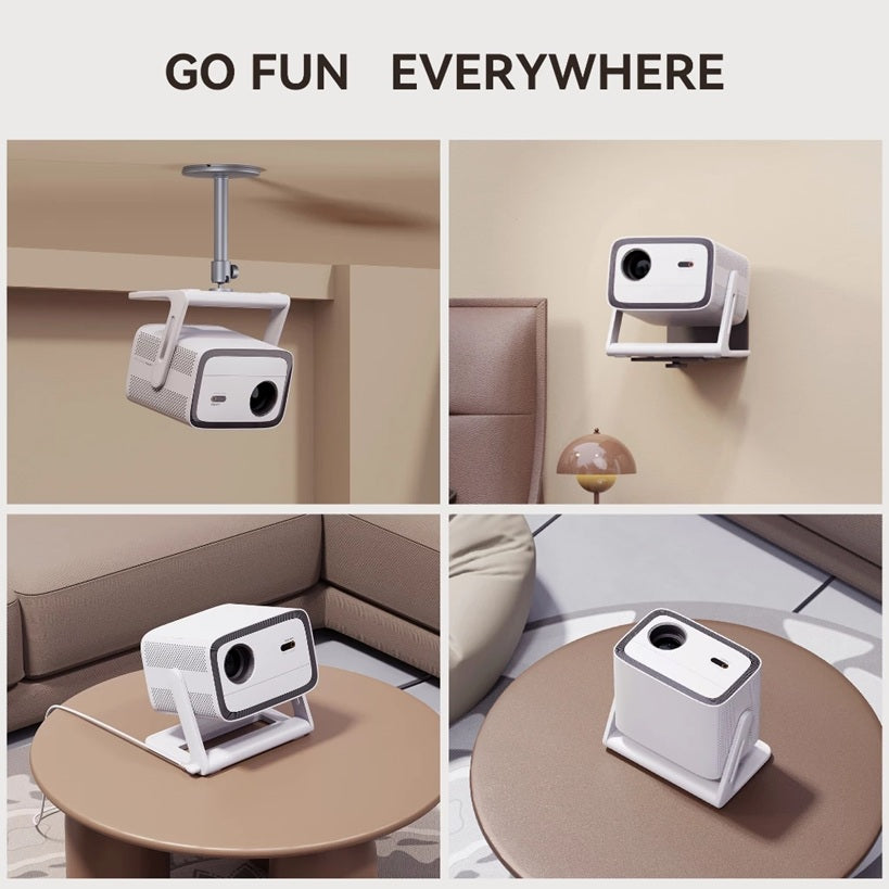 Android TV 11.0 portable projector shown mounted on ceiling wall and placed on tables