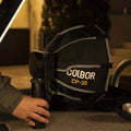 Portable rechargeable battery for LED lights with Colbor CP-30 softbox attached