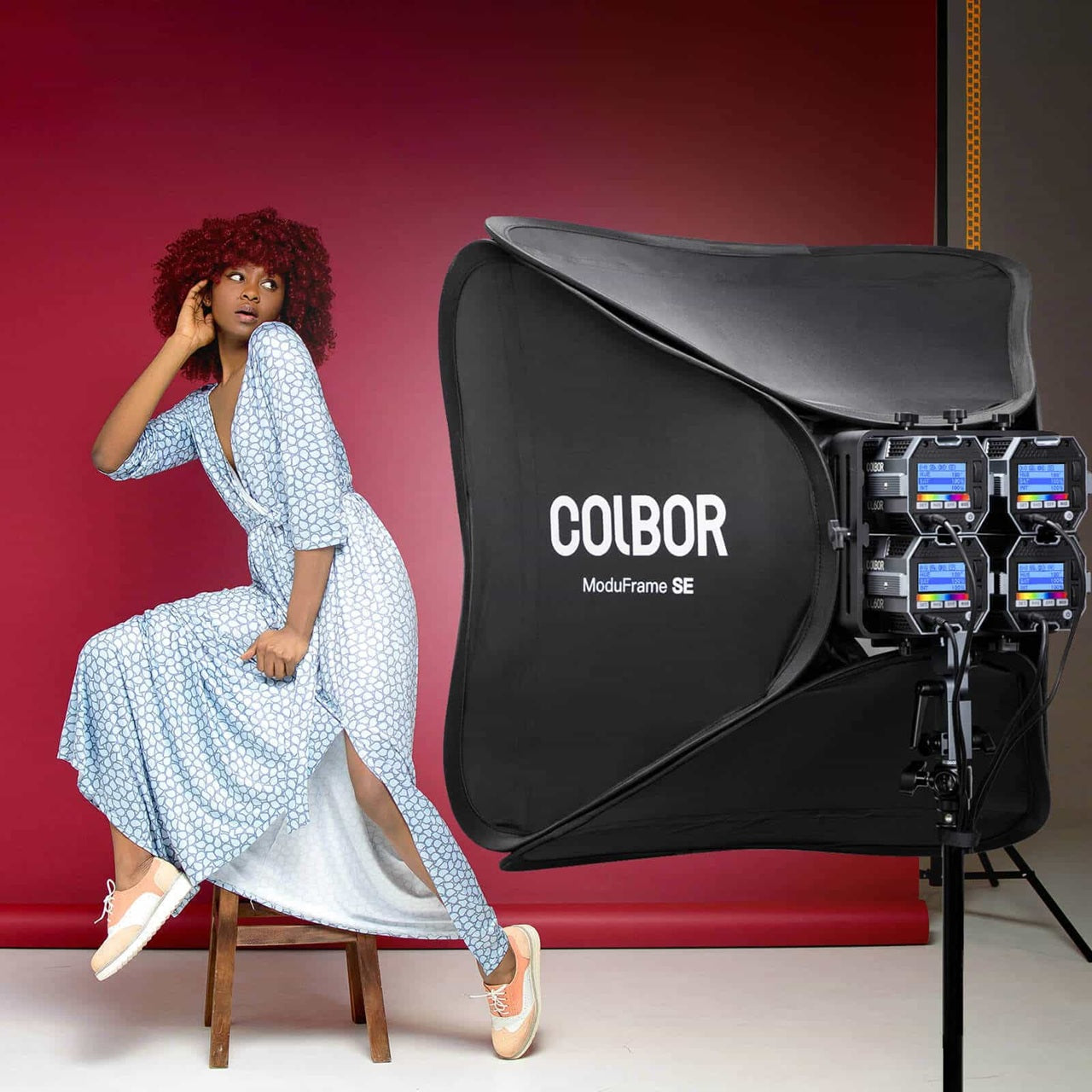 Colbor ModuFrame SE studio lighting softbox for photographers with a model posing in a stylish dress