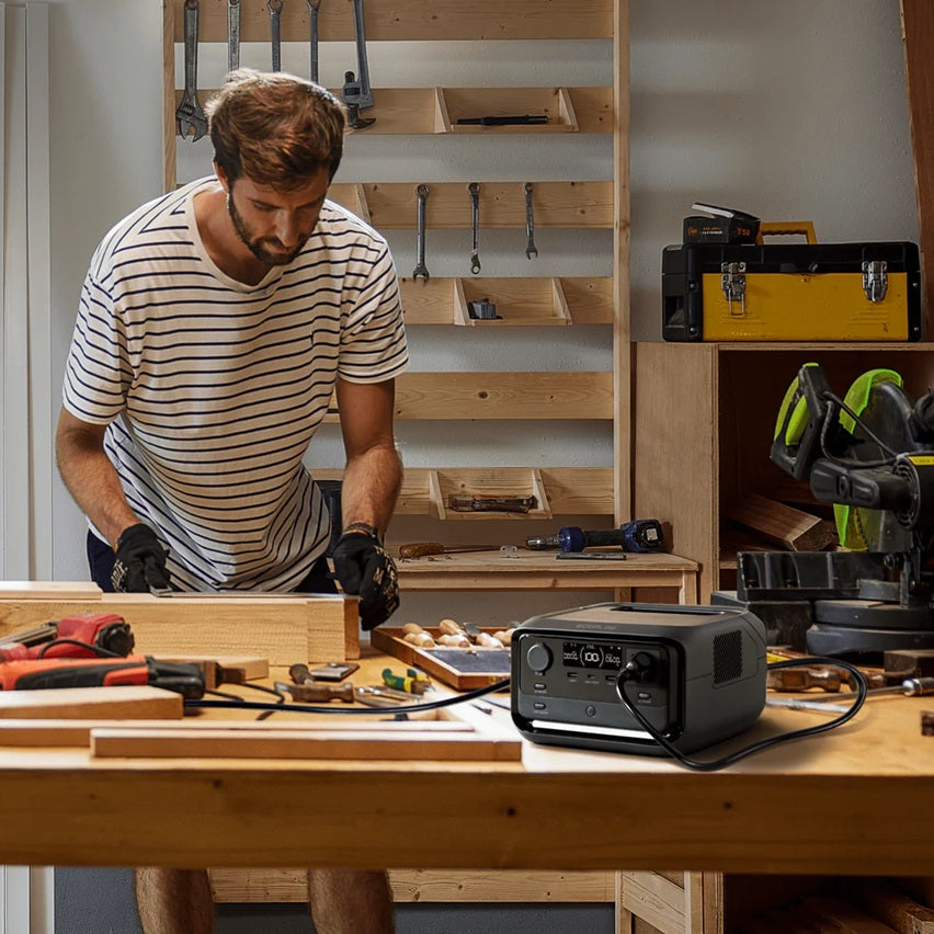 EcoFlow RIVER 3 Plus Best Portable Power Station powering tools on workbench with man working in workshop