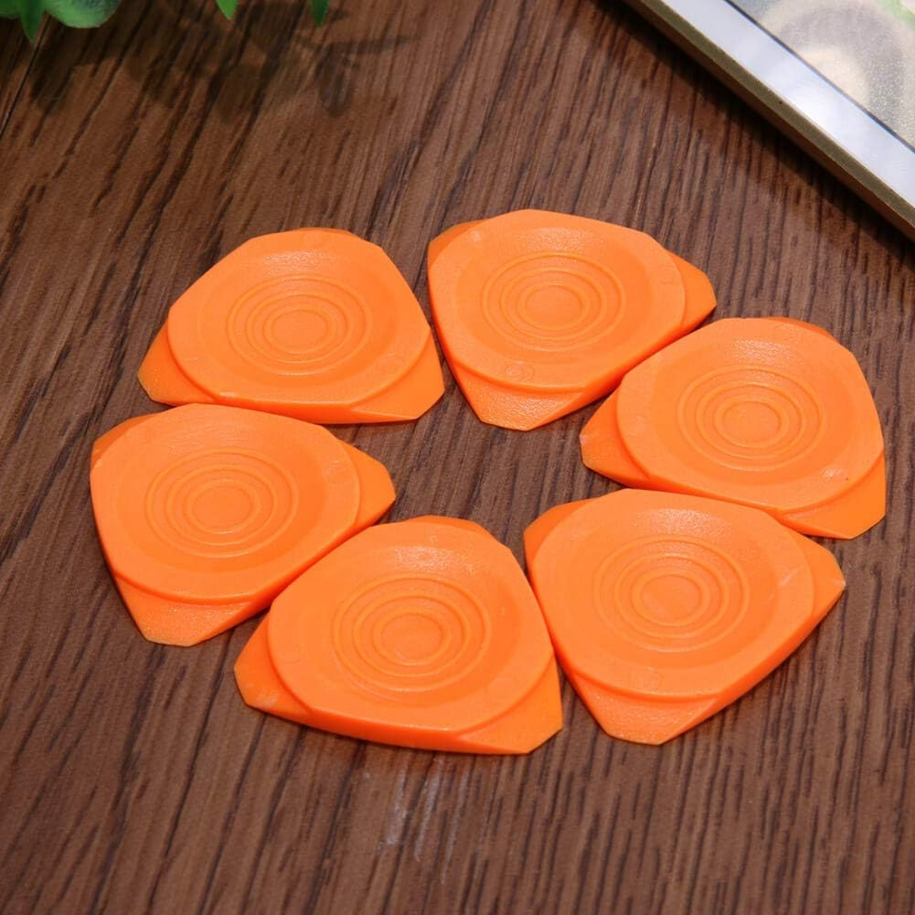Professional phone repair tool kit with six orange adhesive pry tools for easy device repairs
