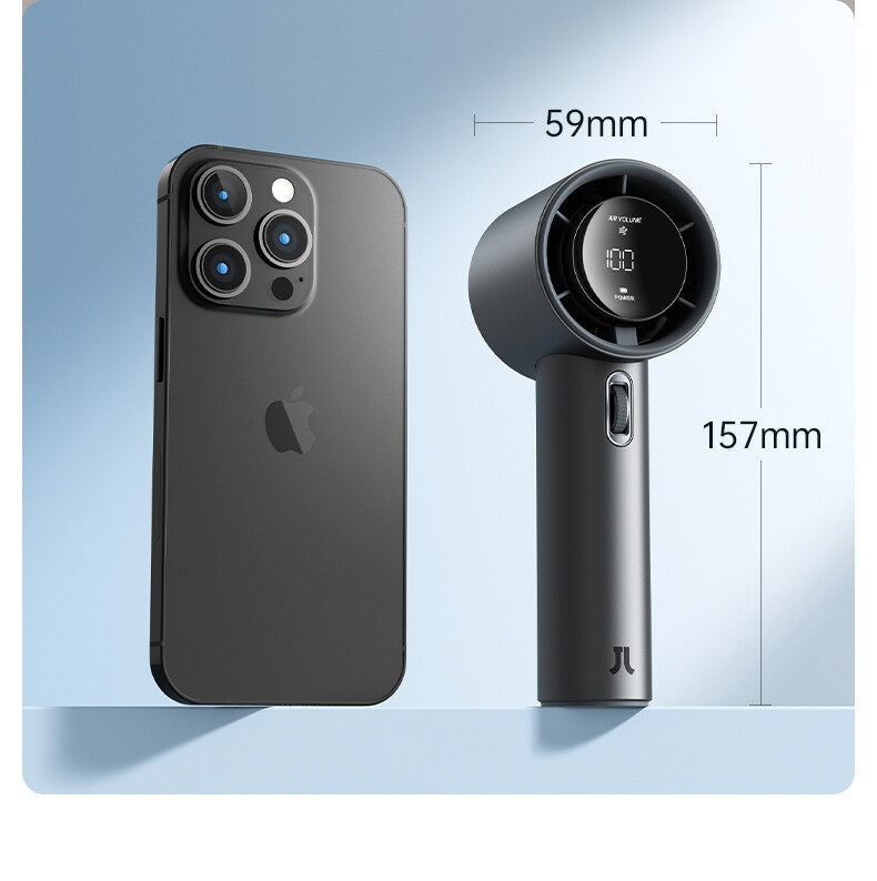 Portable mini handheld fan in black next to smartphone showing compact size and dimensions