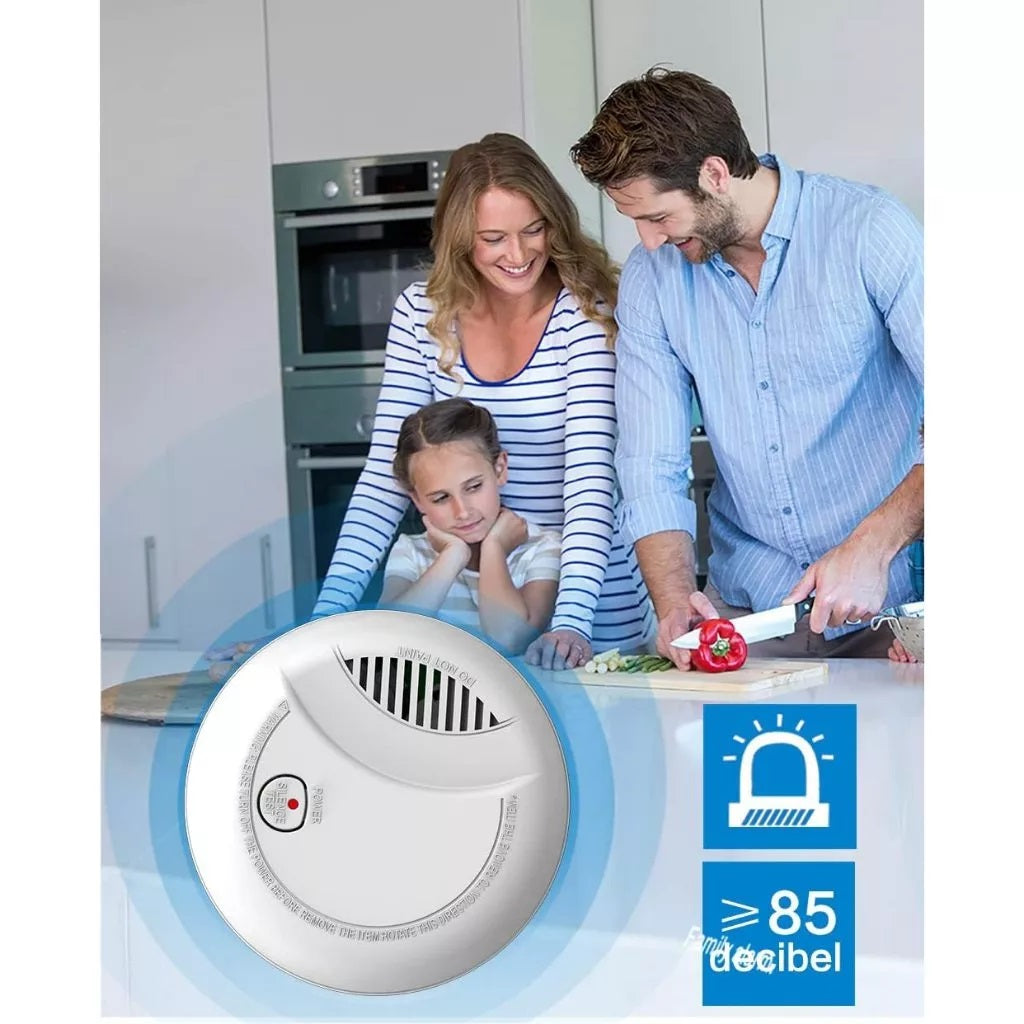 Wireless smoke detector for home with family in kitchen and alarm sound indicator