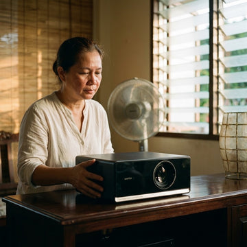 Filipina homeowner placing an android projector with ventilation clearance in a provincial Philippine sala