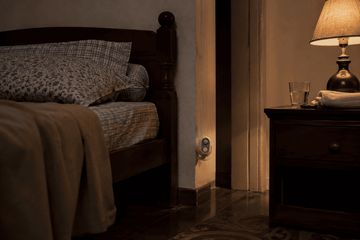 Daytech motion sensor mounted near a bed in a Filipino bedroom for elderly night-time fall alerts