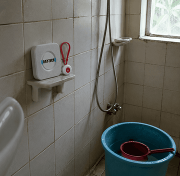 Waterproof Daytech SOS caregiver button mounted in a Filipino bathroom for elderly fall safety