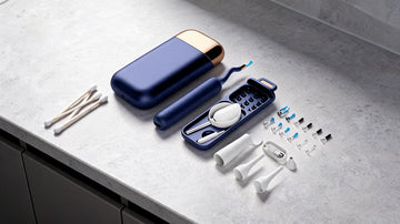 Cotton swabs beside a Bebird ear cleaning camera on a bathroom counter