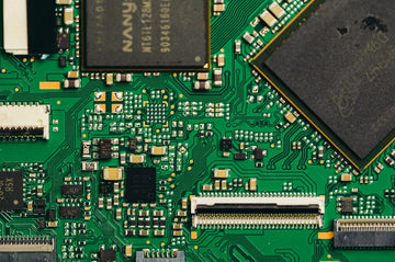 Close-up view of a green circuit board with components
