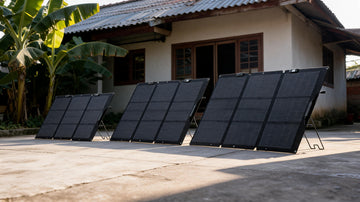 Foldable solar panels from different brands set up for comparison in a Filipino yard