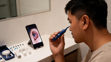 Using a Bebird ear cleaning camera with the phone app at a bathroom vanity