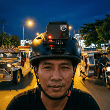 Motovlogger riding at night in the Philippines with SJCAM SJ30 action camera mounted on helmet capturing low-light footage