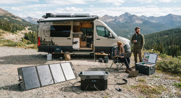 Solar panel connected to a portable power station at a campsite, showing real-world solar recharge setup.