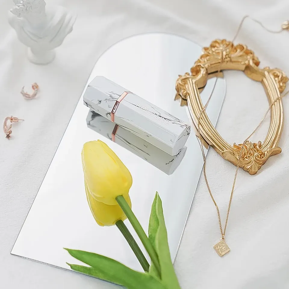 Acrylic Mirror Props displayed with a yellow tulip, jewelry, and decorative items on a soft surface
