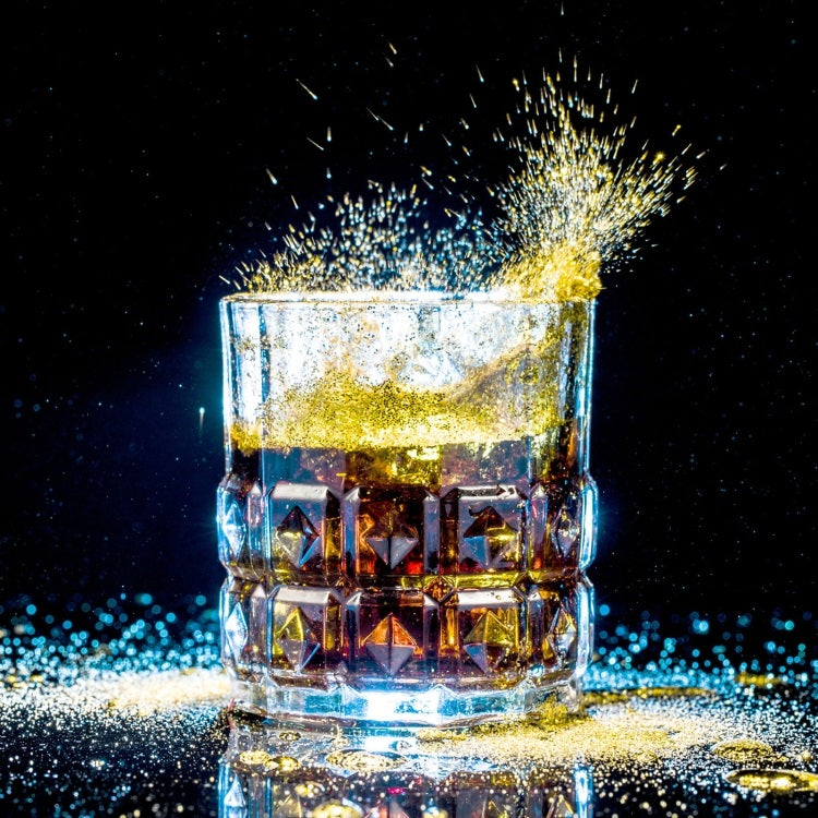 Acrylic Reflective Display Board showcasing a glass of whiskey with shimmering golden sparkles