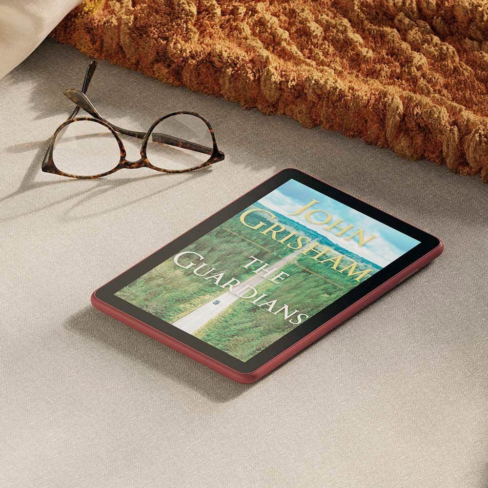 VMIDirect HD Tablet displaying John Grisham's The Guardians on a cozy surface with glasses
