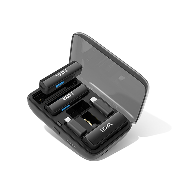 Wireless lavalier microphone with charging box showcasing compact design and included accessories