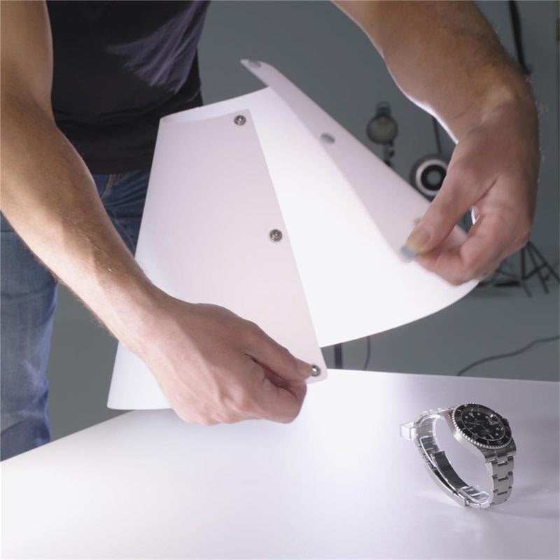 Adjustable Cone Flash Diffuser being placed for optimal lighting on a watch during a photoshoot