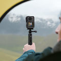VMIDirect action camera mounted on a handheld grip for capturing outdoor adventures