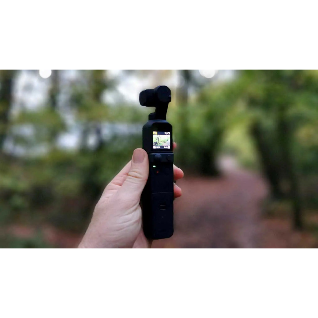 VMIDirect handheld AI Gimbal Camera held in hand with forest background for stable video capture