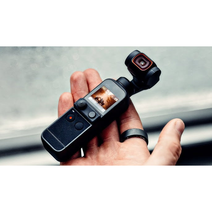 VMIDirect handheld AI Gimbal Camera in a person's hand with touchscreen display and compact design