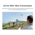Person flying DJI Mini 3 drone with 4K camera using remote controller outdoors over a hill