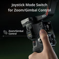 Close-up of DJI RS 4 gimbal stabilizer joystick mode switch for zoom and gimbal control