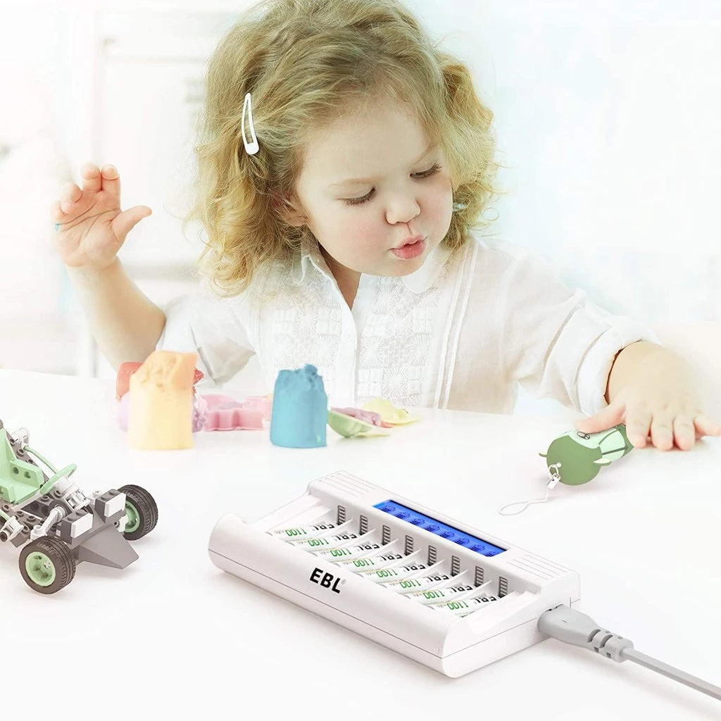 EBL battery charger with LCD display charging AA and AAA batteries on a white surface with child playing nearby