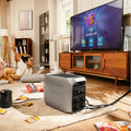DELTA 3 Portable Power Station powering TV in living room with child playing video games nearby