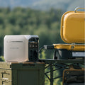 DELTA 3 Portable Power Station by VMIDirect providing power to a yellow portable grill outdoors