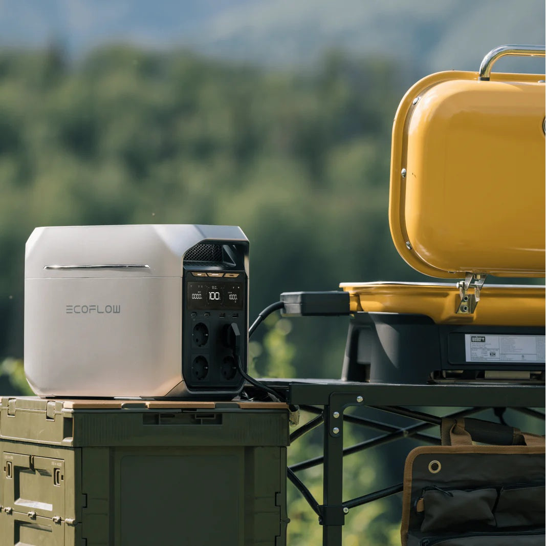 DELTA 3 Portable Power Station by VMIDirect providing power to a yellow portable grill outdoors