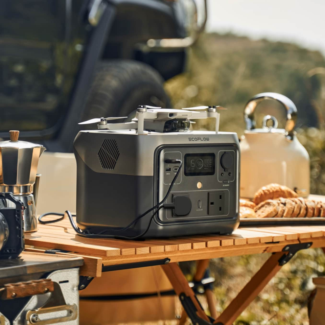 VMIDirect portable power station on a camping table, ideal for outdoor activities and device charging