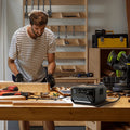 EcoFlow RIVER 3 Plus Best Portable Power Station powering tools on workbench with man working in workshop