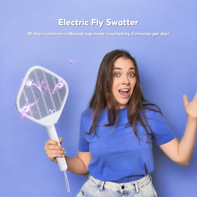Woman using an Electric Mosquito Swatter Racket for effective insect control with purple light features