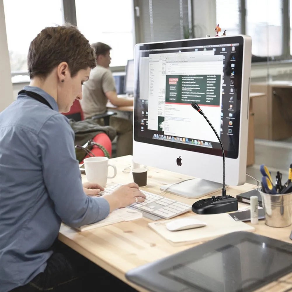 Gooseneck conference microphone with reverb positioned on a desk in a modern office setting
