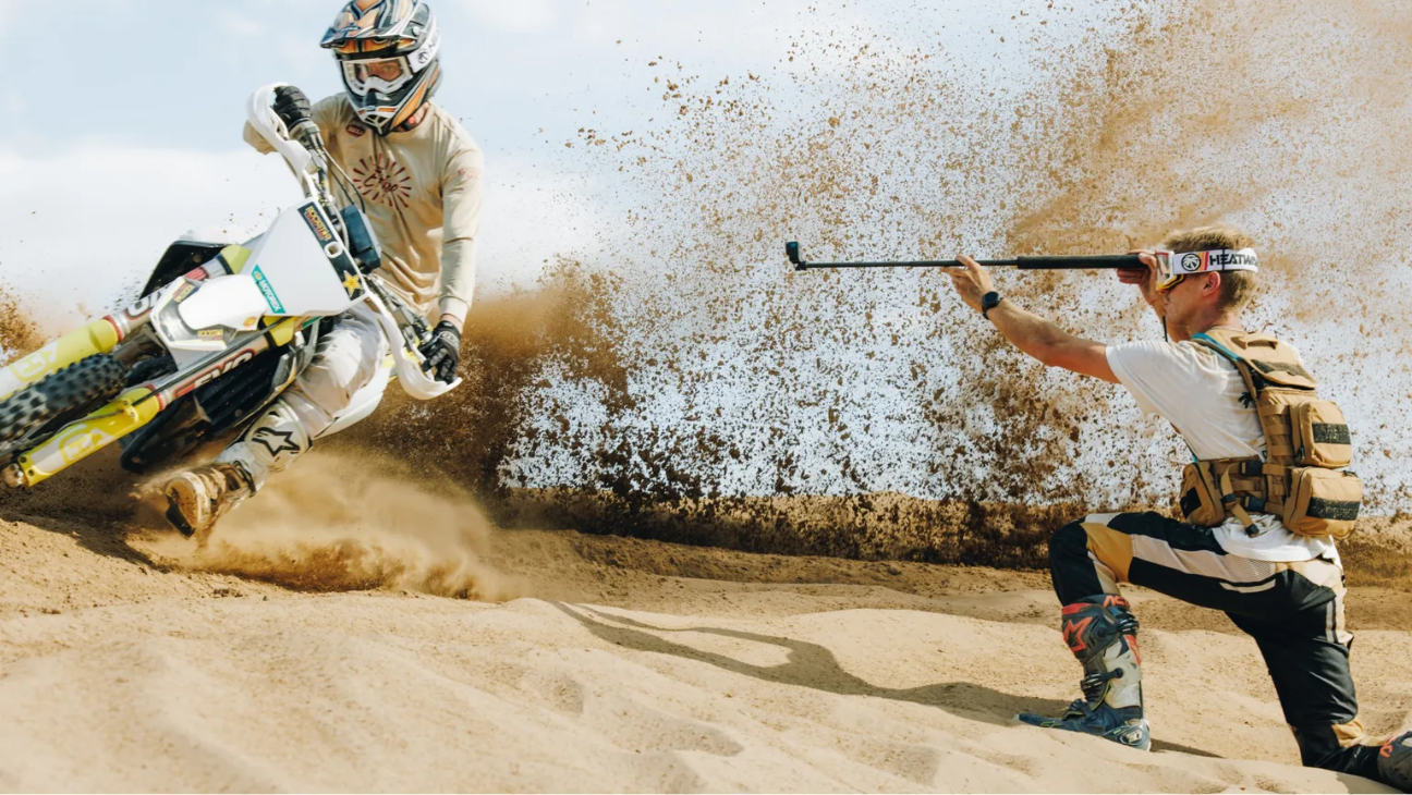 GoPro HERO 13 Black Waterproof Action Camera capturing a motocross rider in action on sandy terrain