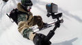 Snowboarder using GoPro HERO 13 Black Waterproof Action Camera while riding on snowy slope