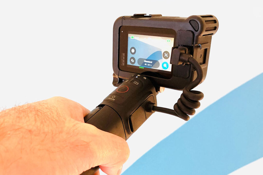 GoPro Media Mod attached to a camera with a handheld grip showcasing screen display for easy operation
