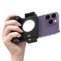GXCT CG-02 Smartphone Camera Grip held in hand with integrated selfie light for enhanced photography