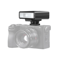 GXCT F12 Mini Camera Flash mounted on a camera for enhanced photography lighting