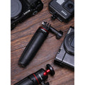 GXCT MT-09 Mini 2-in-1 Vlog Tripod on a wooden surface surrounded by cameras