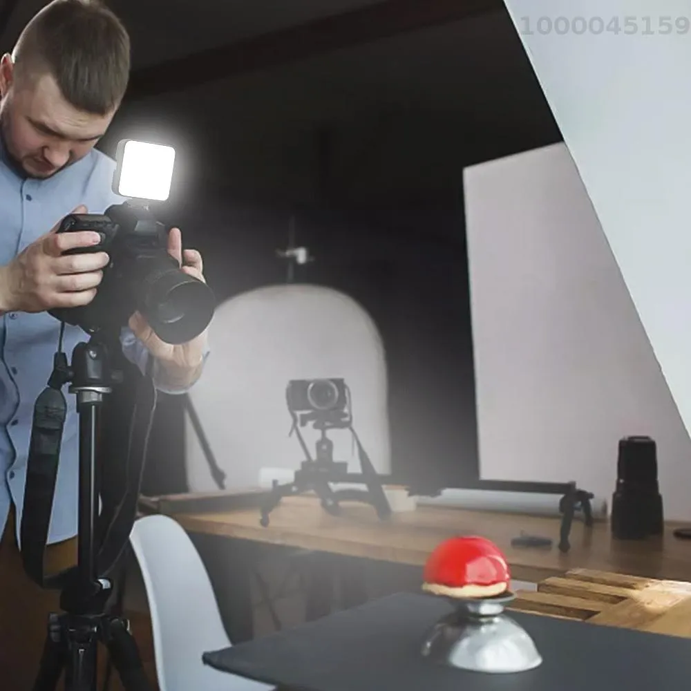 GXCT T64 Pocket LED Video Light used by a photographer in a studio setting for product photography