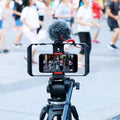 GXCT U-Rig Pro Smartphone Video Rig mounted on a tripod filming a dance class outdoors