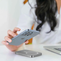 VMIDirect Magnetic Wireless Power Bank charging a smartphone on a desk for convenient use