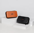 Mini trunk carrying pouch for gimbal in black and orange colors on display