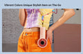 Jisulife life 4 strong wind fan handheld pink fan hanging from colorful lanyard worn with orange pants and tie dye shirt