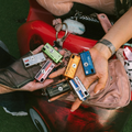 Various CHARMERA Keychain Digital Cameras in colorful designs held in hands for portable photography