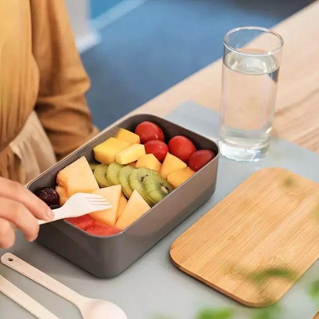 VMIDirect Leak-Proof Bento Lunch Box filled with fresh fruits and a fork on a table