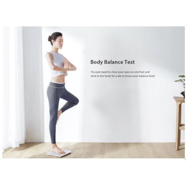 VMIDirect Smart Body Scale displayed with a woman performing a balance test in a bright room