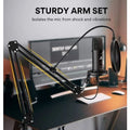 USB Microphone mounted on a sturdy arm set to reduce shock and vibrations in a home studio setup